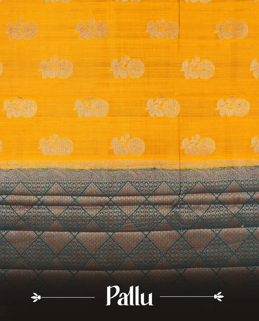 Mustard Colour Pure Banaras soft Silk Saree having gold floral motifs on Body with contrast Dark teal colour gold zari Border and matching Blouse