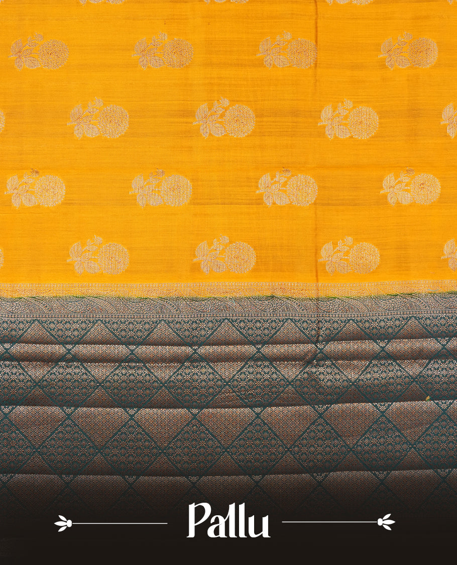 Mustard Colour Pure Banaras soft Silk Saree having gold floral motifs on Body with contrast Dark teal colour gold zari Border and matching Blouse