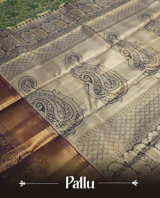Light green colour and Antique silver Zari Tissue Brocade Saree features intricate floral Motifs on body and navy blue colour traditional border & pallu with floral  patterns, paired with matching blouse