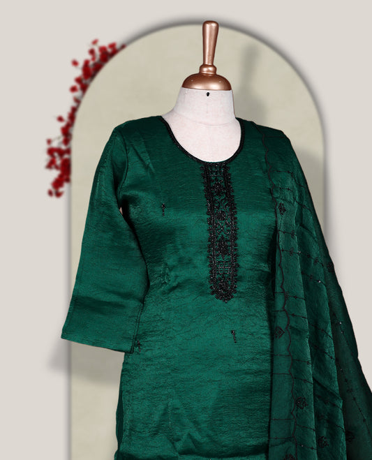 Green colour churidar set adorned with intricate black cut bead work on the neckline, paired with a matching bottom & The set comes with a lightweight embroidered dupatta, adding elegance and charm to your ethnic look.