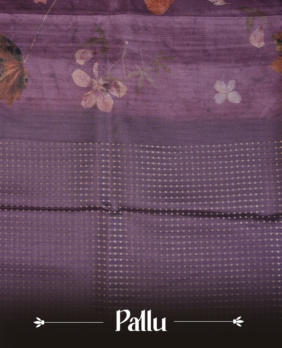 Grape colour tussar saree featuring woven Eco leaves printed on the body, complemented by a self colour gold zari bindi butta border & pallu, paired with a matching blouse.