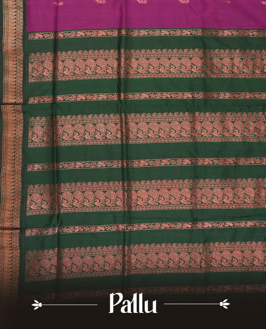 Purple colour Kalyani cotton saree with intricate small motifs all over, paired with a contrasting dark green rich zari woven border and rich peacock worked pallu & Comes with a matching blouse piece