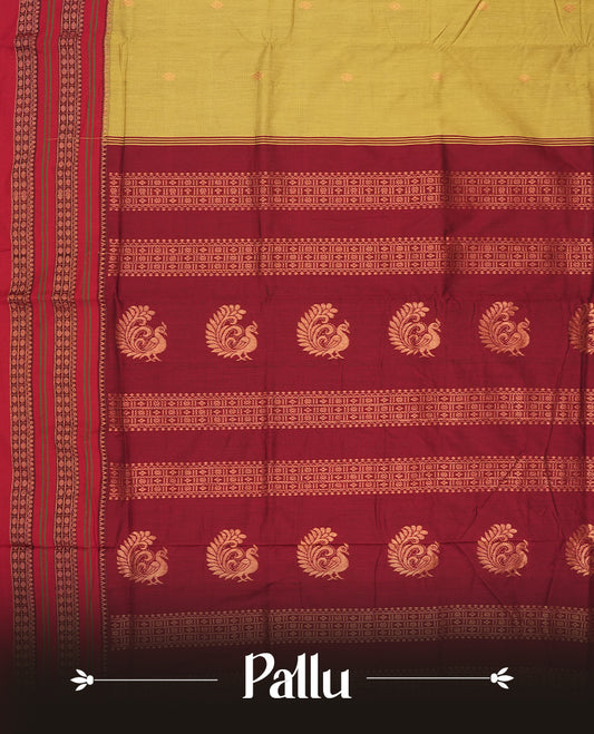 Deep mustard yellow Kalayani cotton saree with delicate woven motifs on the body, enhanced by a rich maroon zari border and pallu with traditional patterns, paired with a matching blouse piece.