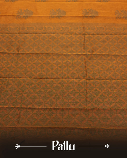 Deep mustard colour silk cotton saree featuring subtle elegant floral woven motifs on the body, complemented by a classic contrast border and pallu with intricate traditional detailing & Comes with a matching blouse piece.