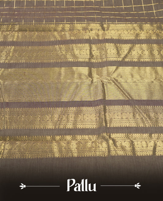 Grey colour Pure Kanchi cotton saree adorned with golden checks, complemented by a rich maroon zari border, paired with a matching blouse & A timeless blend of tradition and elegance, perfect for festive and casual wear.