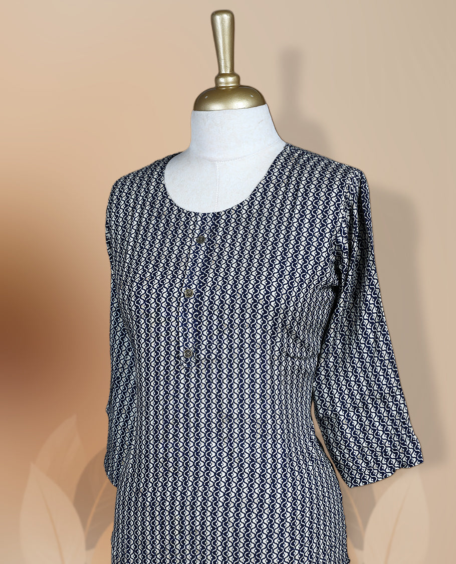 Navy blue colour kurthi adorned with delicate cream colour floral prints, featuring a round neckline and three quarter sleeves & Crafted for comfort and style, perfect for casual and semi formal occasions.