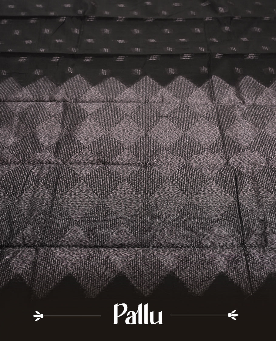 Black Silk Cotton Saree with Silver Butta Body and Ornamental Leaf Motif, Featuring Decorative Scalloped Silver Zari Border on Grand Pallu, Paired with Matching Plain Black Blouse Piece