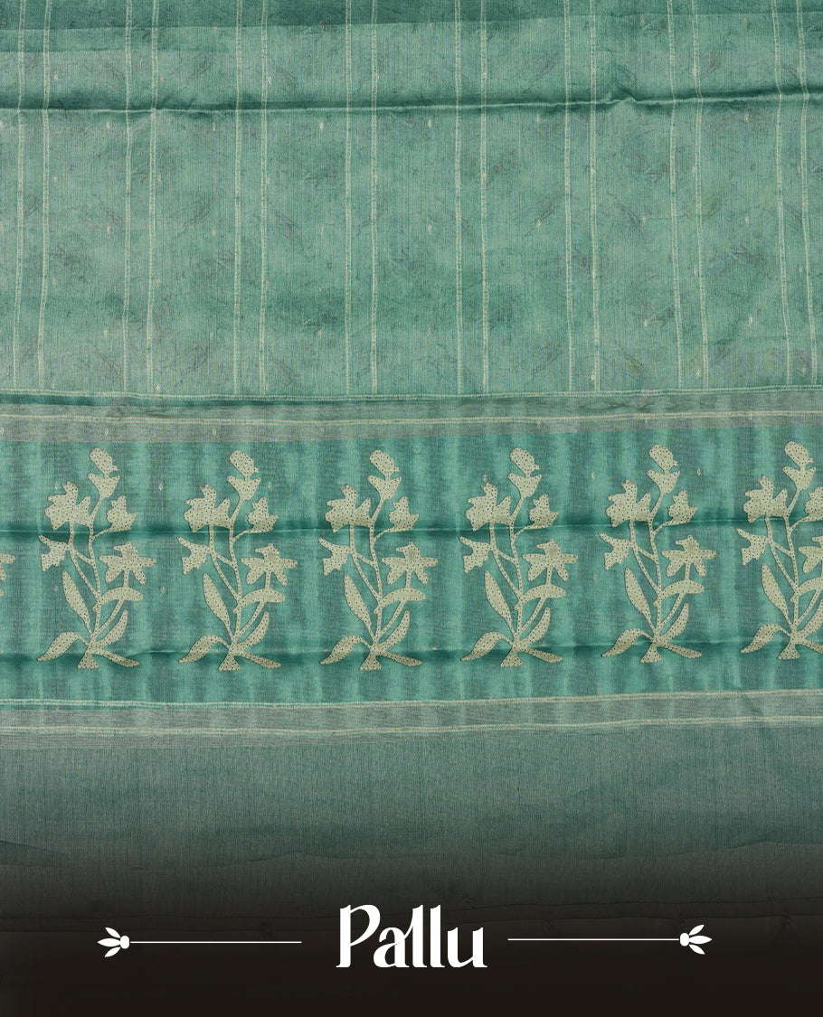 Light Aqua green colour semi tussar saree adorned with Cream strip printed pattern across the body and Floral pattern contrast Aqua green colour on border, paired with a matching blouse.