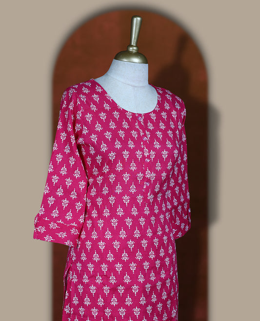 Magenta colour coord set adorned with all over floral prints, featuring a straight cut kurta with round neckline and 3/4th sleeves, paired with matching bottoms.