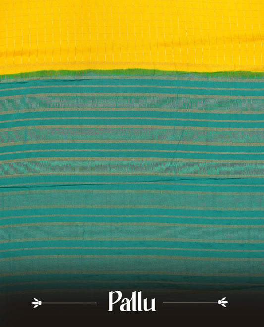 Yellow colour mysore crepe saree with gold zari check pattern on body, complemented by contrast Green colour border featuring peacock and chakkram motifs, paired with matching blouse.