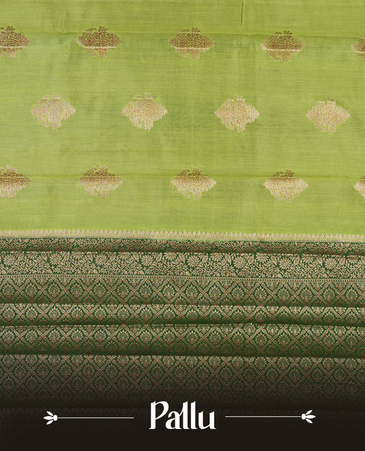 Green Banaras soft silk saree with gold zari motifs on body, with contrast Dark green colour floral pattern on pallu, border, and Matching blouse.