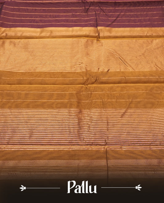 Dark maroon Colour silk cotton saree with fine antique gold pinstripes throughout the body, tawny bronze pallu with layered gold bands, plain tawny bronze blouse. Elegant color blocking perfect for festive occasions.