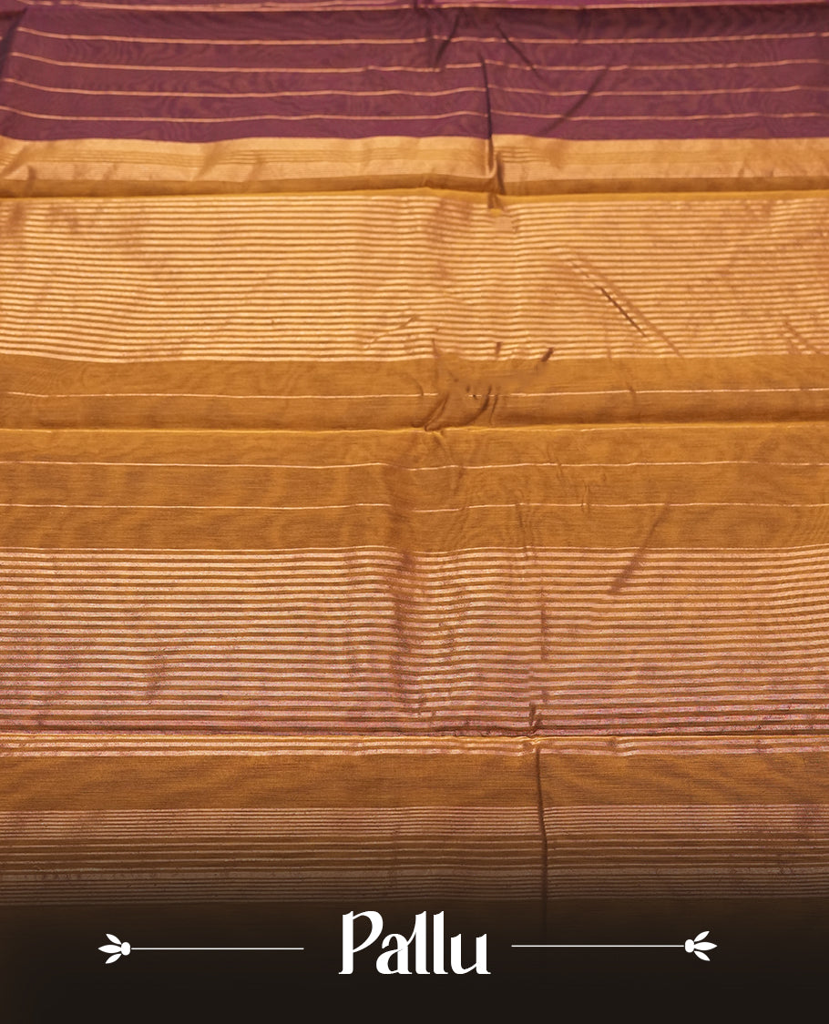 Dark maroon Colour silk cotton saree with fine antique gold pinstripes throughout the body, tawny bronze pallu with layered gold bands, plain tawny bronze blouse. Elegant color blocking perfect for festive occasions.