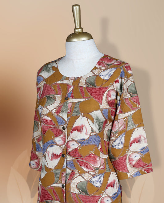 Mustard colour kurthi adorned with delicate floral prints, featuring a round neckline and three quarter sleeves & Crafted for comfort and style, perfect for casual and semi formal occasions.