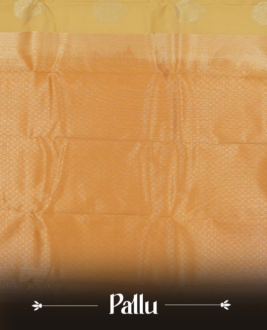 Muted yellow colour semi soft silk saree featuring a gold zari motifs on body, complemented by contrast mustard colour with gold traditional  pallu & border and a matching blouse piece.