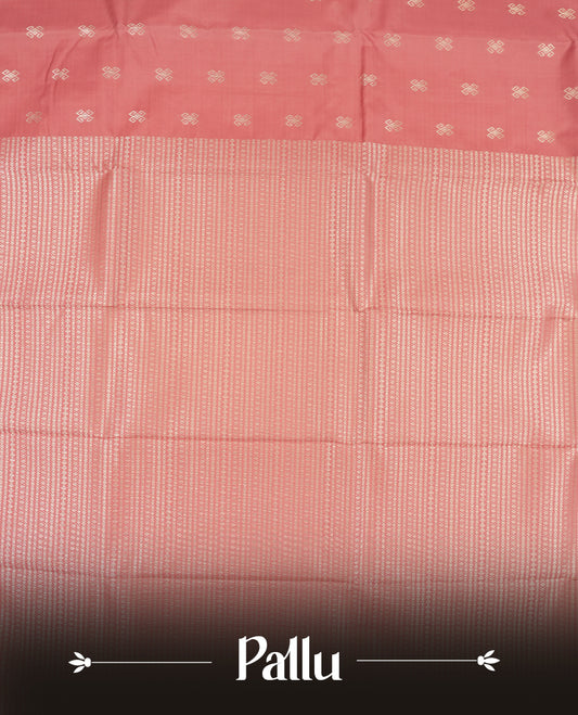 Dusty rose colour semi soft silk saree featuring a golden textured patterned body, complemented by self coloured golden zari motifes on pallu & border and a matching blouse piece.