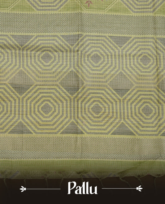 Leaf green colour semi tussar silk saree, featuring subtle hexagonal geometric patterns across the body, a textured pallu with fine detailing, and finished with a matching blouse.