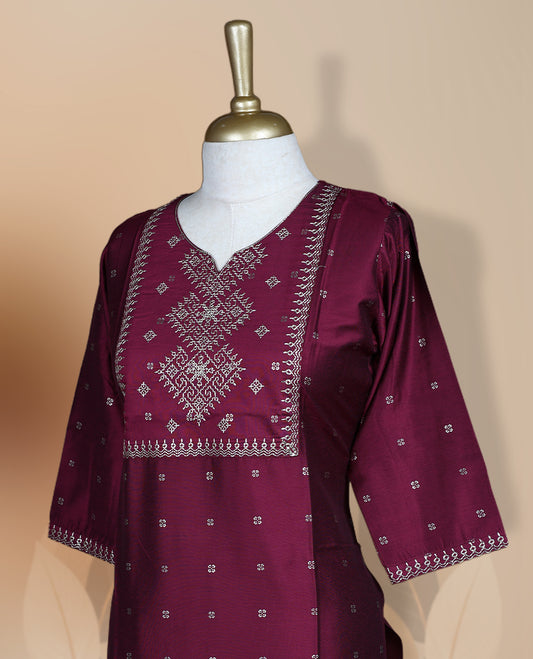 Dark magenta colour kurthi adorned with intricate embroidery on the yoke and delicate floral patterns all over, Designed with a 3/4th sleeves, perfect for casual and semi formal occasions.