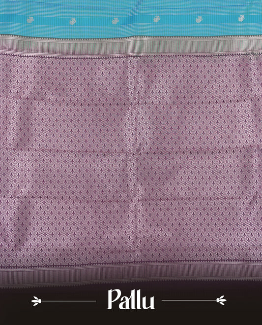 Aqua blue colour Semi Silk Saree with silver zari patterns on the body, paired with a contrasting dark violet colour traditional pallu and border, and a matching blouse piece.