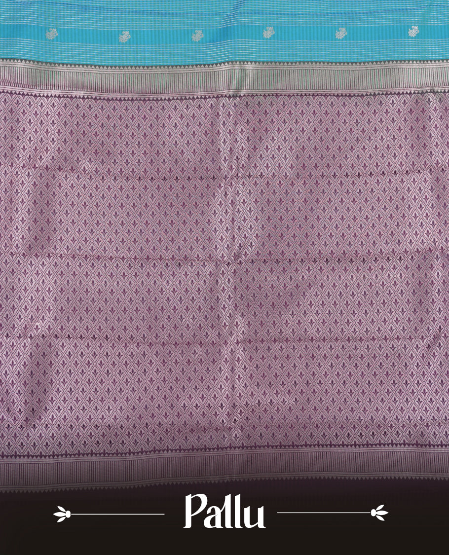 Aqua blue colour Semi Silk Saree with silver zari patterns on the body, paired with a contrasting dark violet colour traditional pallu and border, and a matching blouse piece.