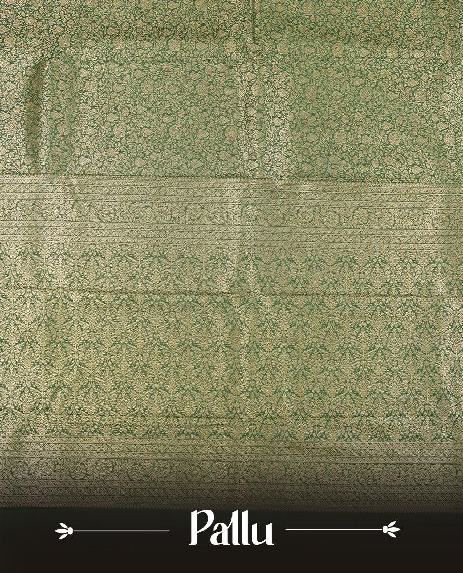 Green colour semi silk brocade saree featuring intricate Gold Floral kodi patterns across the body, complemented by a rich self colour woven border and pallu, paired with a matching blouse.