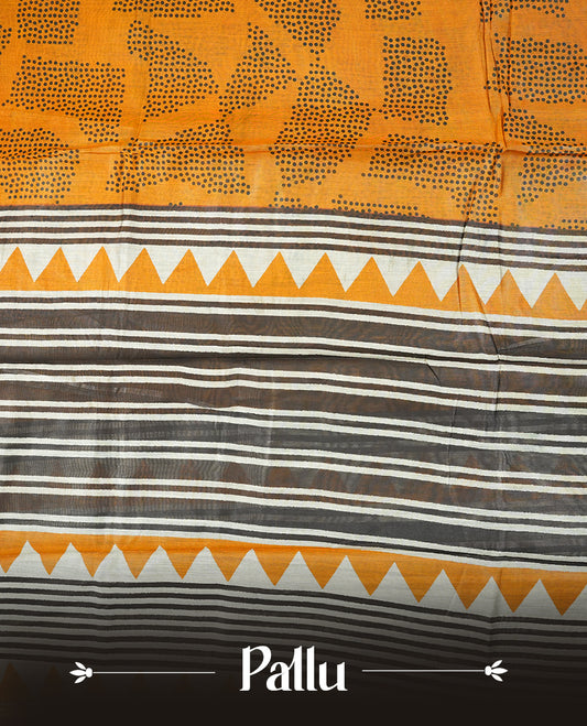 Mustard yellow colour chanderi cotton saree featuring black polka dot printed body,striped pallu with geometric patterns, golden zari border, and matching mustard yellow plain blouse.