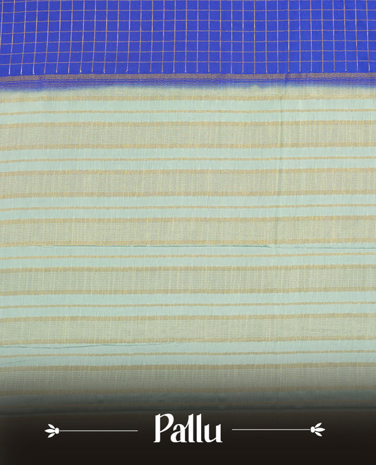 Blue colour mysore crepe saree with gold zari check pattern on body, complemented by contrast sky blue colour border featuring peacock and chakkram motifs, paired with matching blouse.