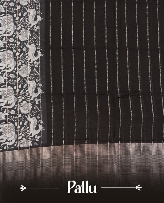 Black colour chanderi silk saree with gold zari strip pattern On body, compilmented by self colour border with antique zari pattern & white animal & forest print pattern and a matching blouse.