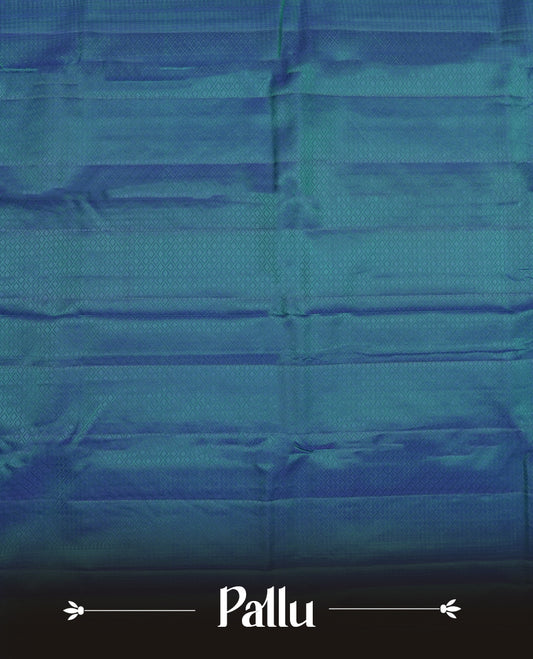 Peacock blue colour semi soft silk saree featuring a self coloured textured patterned body, complemented by self coloured tiny diamond motifes on pallu & border and a matching blouse piece.