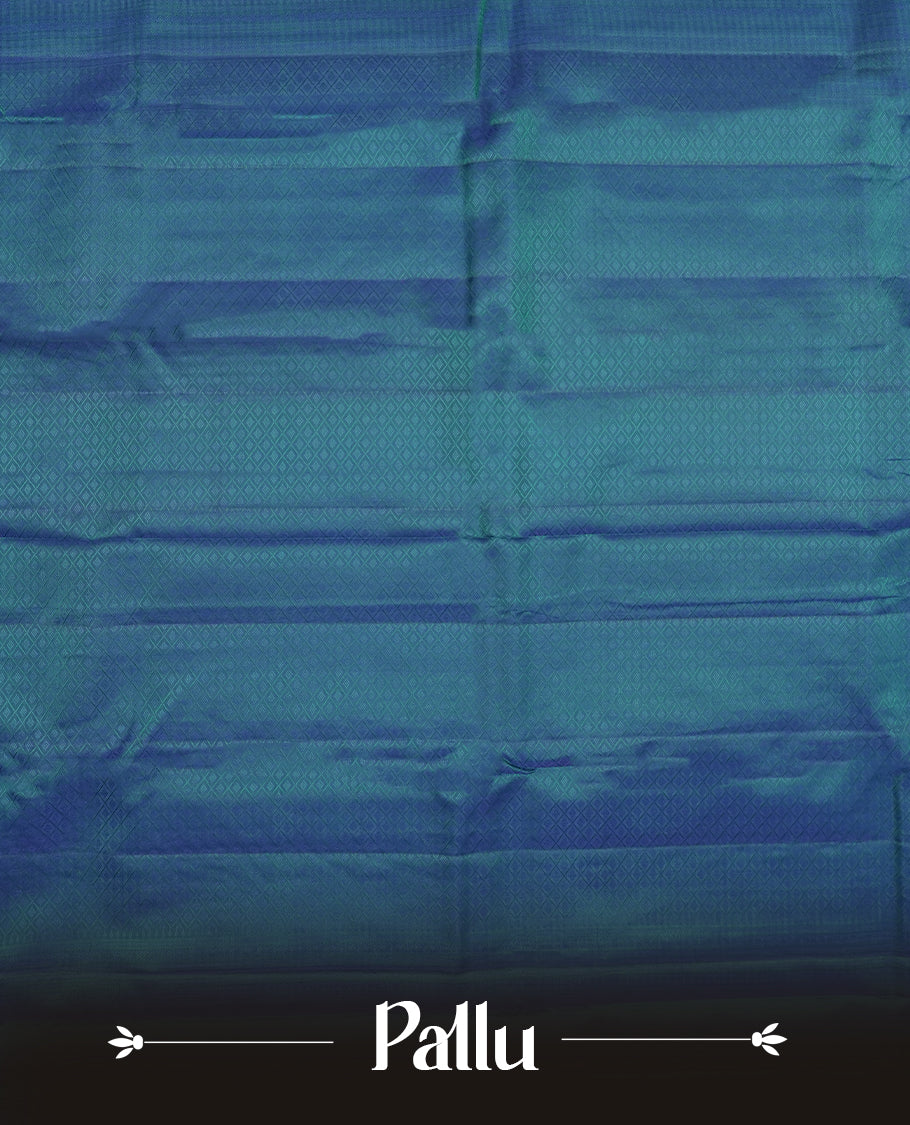 Peacock blue colour semi soft silk saree featuring a self coloured textured patterned body, complemented by self coloured tiny diamond motifes on pallu & border and a matching blouse piece.