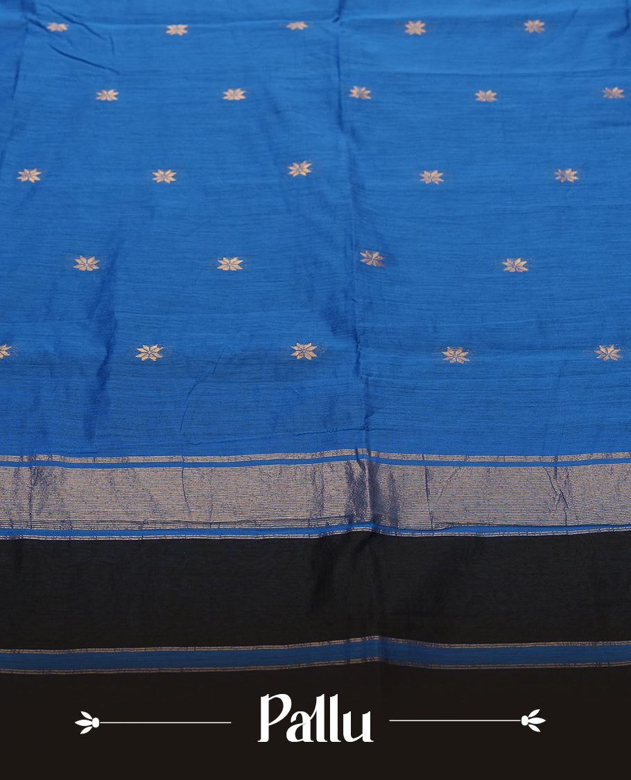 Black and Royal Blue Colour silk cotton saree with gold zari star buttas, blue pallu with zari stripes and buttas, slim antique-gold borders, and a plain blue blouse featuring matching zari edging