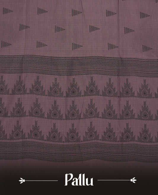 Black and Onion mix colour poly cotton saree with black temple motifs on the body, paired with a matching with black woven traditional border, and a coordinated all‑over geometric printed blouse piece.