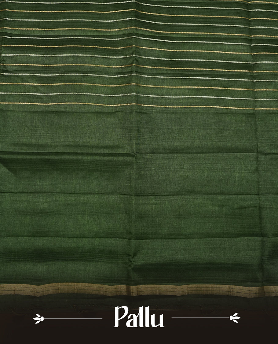 Green colour semi tussar silk saree highlights gold and silver zari stripes across body,  border, pallu and paired with matching blouse piece.