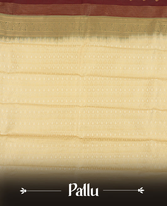 Dark brown colour Semi Silk Saree with gold zari patterns on the body, paired with a contrasting cream colour traditional pallu and border, and a matching blouse piece.