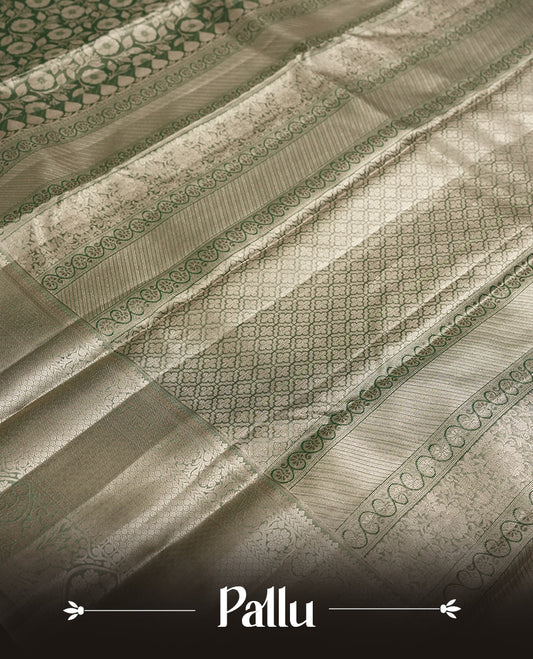 Dull green colour and Antique gold Zari Tissue Brocade Saree features intricate floral Motifs on body and fancy border & pallu with floral patterns, paired with matching blouse