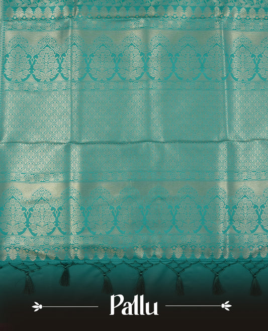 Teal colour semi soft silk saree featuring an all-over woven leaf pattern, finished with a matching border adorned with detailed paisley and floral motifs, and a matching blouse piece.