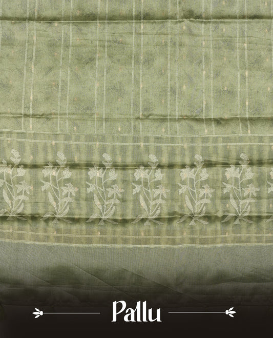 Sage green colour semi tussar saree adorned with Cream strip printed pattern across the body and Floral pattern contrast fern green colour on border, paired with a matching blouse.