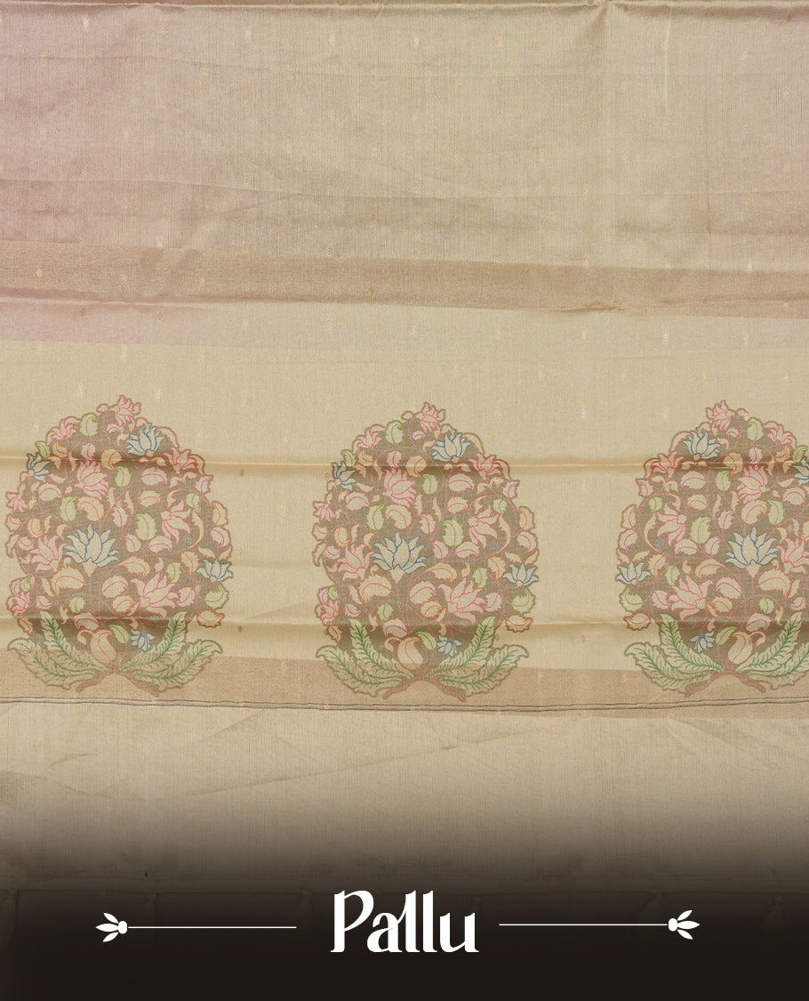 Rose gold colour semi tussar saree adorned with gold zari motifs across the body and Floral pattern contrast cream colour on border, paired with a matching blouse.