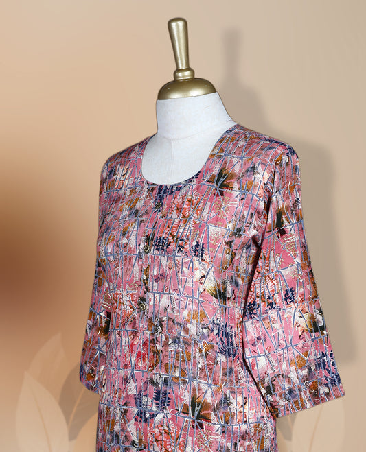 Pink colour kurthi adorned with delicate cream & navy blue colour floral prints, featuring a round neckline and three quarter sleeves & Crafted for comfort and style, perfect for casual and semi formal occasions.