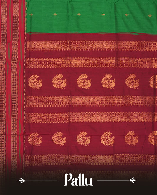 Royal green colour Kalyani cotton saree with contrast maroon border adorned with intricate golden zari weaving & Paired with matching blouse.