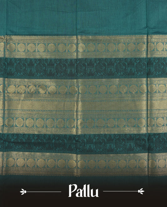 Teal blue colour Chettinad cotton saree featuring a rich contrast navy blue colour border adorned with intricate golden zari circular motifs and geometric designs & it comes with a matching blouse piece.