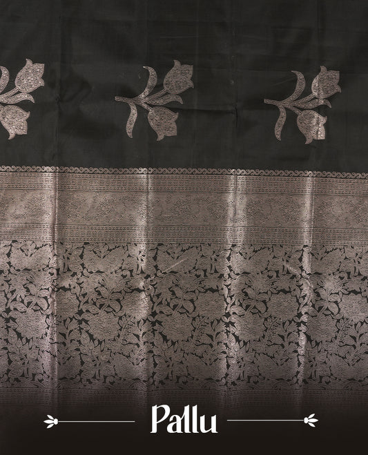 Black Semi Silk Saree with Silver Zari Floral Woven Pallu and Border, Subtle Zari Butta Motifs on the Body, Tassel Detailing, and Coordinated Blouse Piece