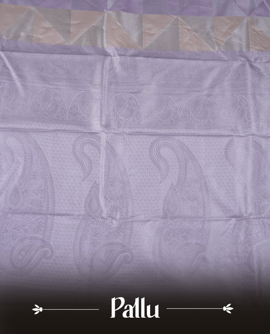 Lavender & cream colour semi soft silk saree featuring a silver zari patterned body, complemented by silver zari motifes on pallu & border and a matching blouse piece.