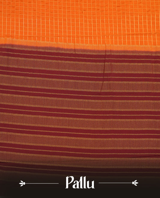 Orange colour mysore crepe saree with gold zari check pattern on body, complemented by contrast Chocolate brown colour border featuring peacock and chakkram motifs, paired with matching blouse.