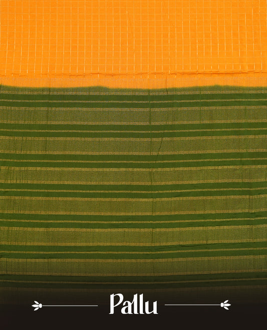 Mustard colour mysore crepe saree with gold zari check pattern on body, complemented by contrast Green colour border featuring peacock and chakkram motifs, paired with matching blouse.