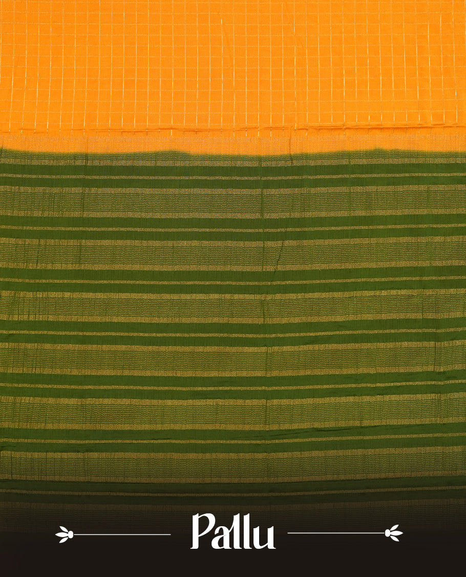 Mustard colour mysore crepe saree with gold zari check pattern on body, complemented by contrast Green colour border featuring peacock and chakkram motifs, paired with matching blouse.