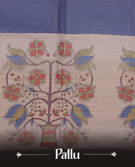 Wheat colour semi tussar silk saree featuring floral print and check pattern across body, contrast blue colour border and pallu, paired with matching blouse piece.