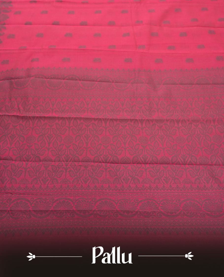 Crimson pink colour silk cotton saree featuring elegant floral zari motifs on the body, complemented by a rich contrast dark plain grey border and pallu with traditional woven detailing & Comes with a matching blouse piece.