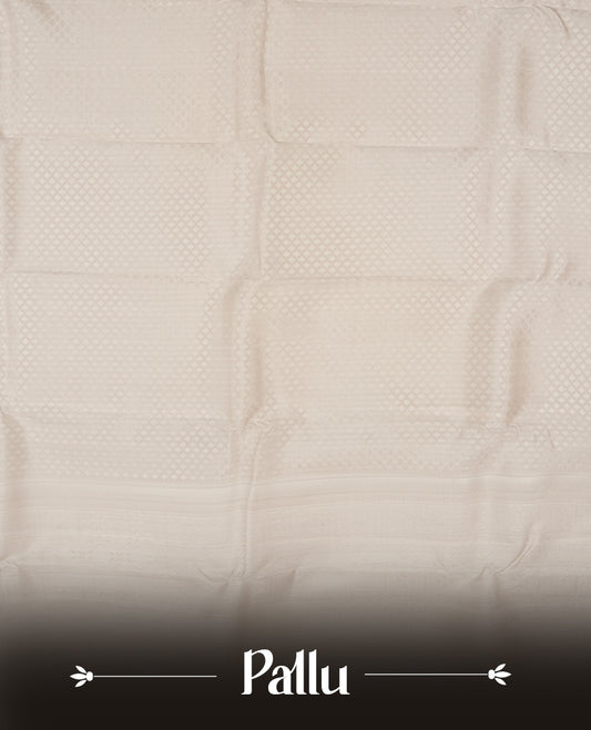 Off white colour semi soft silk saree featuring a self coloured textured patterned body, complemented by self coloured Square motifs on pallu & border and a matching blouse piece.