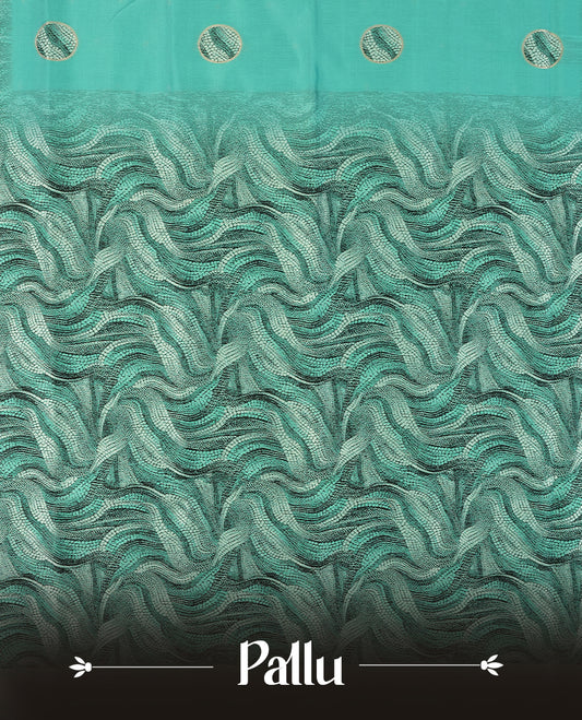 Aqua green semi silk saree featuring elegant circular motifs on the body, complemented by a striking pallu adorned with intricate wavy white and black thread patterns with golden border, and paired with a matching blouse
